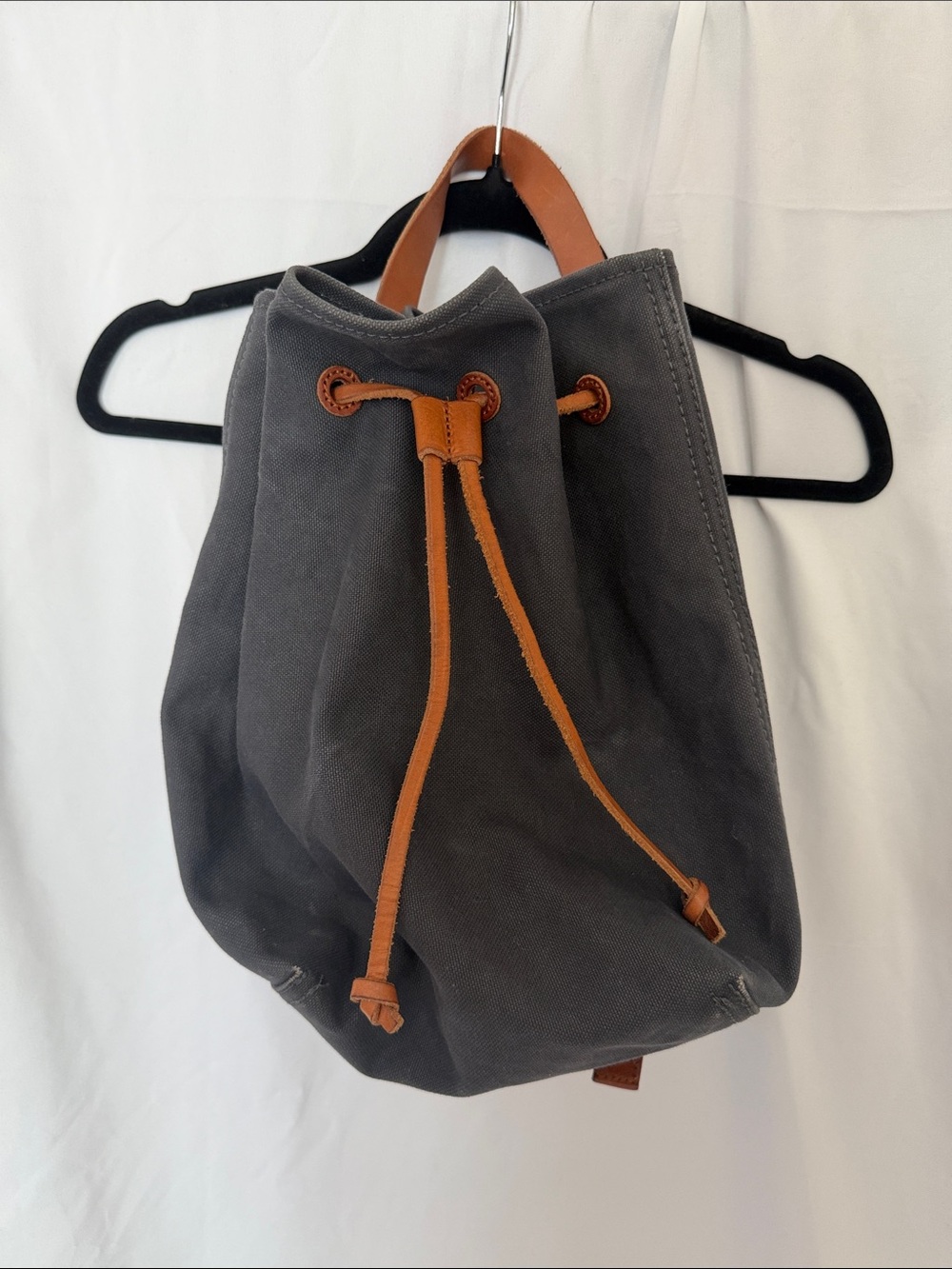 Small blue Madewell canvas backpack with leather straps